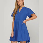 Coastal Curves Dress in cobalt blue with scalloped sleeves and hem, perfect for a stylish summer look.