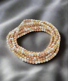 CB2194 7 Piece CCB Stretch Bracelet Set featuring multicolored 4mm beads in gold, silver, and rose gold tones.