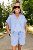 Misty Harbor sky blue stripe shorts set featuring a dolman sleeve polo top and drawstring shorts, ideal for summer wear.