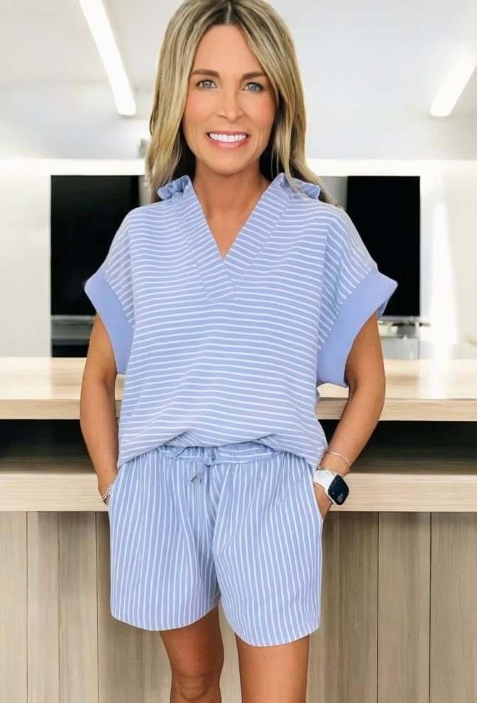 Misty Harbor 2-piece shorts set in sky blue stripes featuring a stylish dolman sleeve polo top and drawstring shorts.