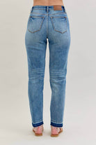 Back view of JUDY BLUE - AVERY JEANS showcasing the modern release hem detail and relaxed boyfriend cut.