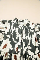 Woodland Walks Dress with flutter sleeves and floral print, featuring a half-button placket in forest green.