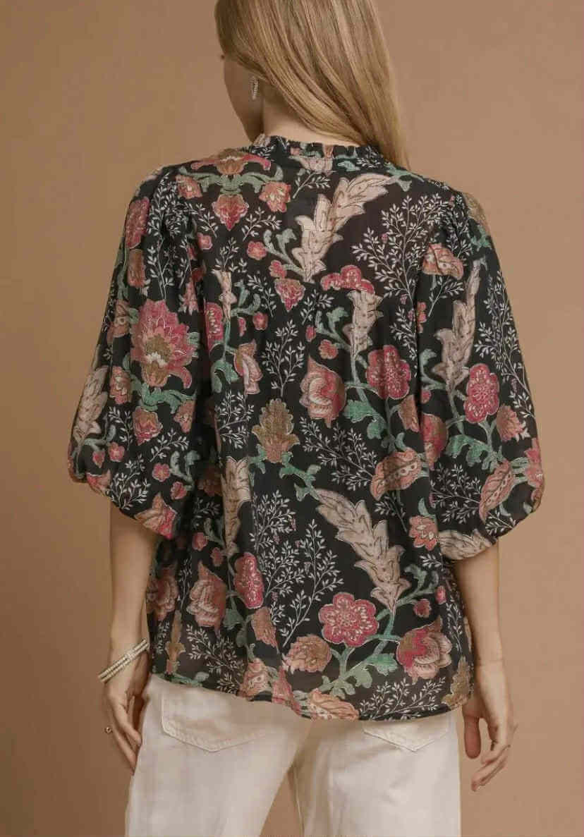 Back view of the FOREVERMORE TOP - Umgee featuring a floral print and puff sleeves.