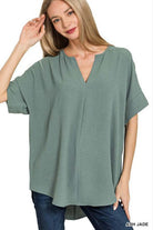 Model showcasing the Soft Breeze Top in Ash Jade, featuring a relaxed fit for effortless comfort and style.