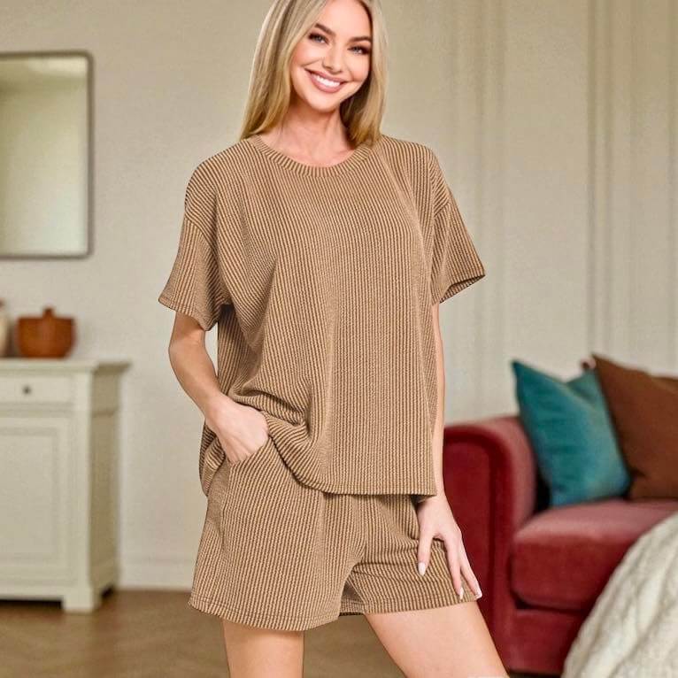 Woman in toffee ribbed 2-piece shorts set, showcasing relaxed fit and cozy style, perfect for fall lounging.