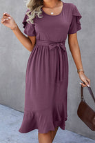 Chic purple midi dress with petal sleeves, ruffle trim, and belted waist, perfect for casual outings.