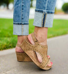 Corky's Carley studded wedges in tan worn with rolled jeans, showcasing comfort and style.