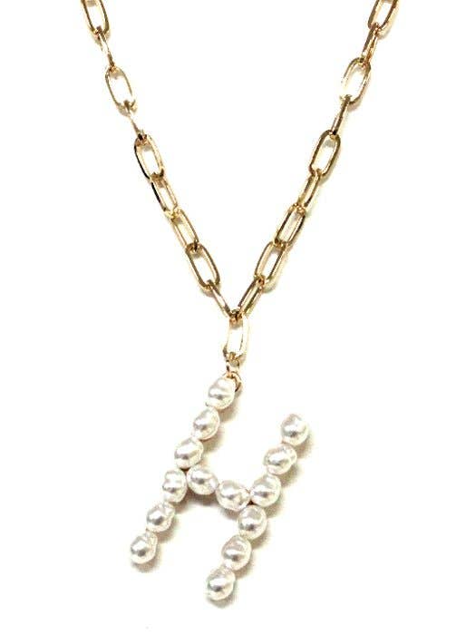 Gold-tone chain necklace with a pearl monogram pendant in the shape of the letter "H" from Avenue Zoe.