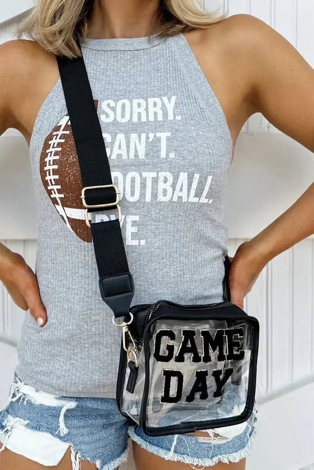 Stylish woman wearing GAME DAY clear crossbody bag, showcasing team spirit and ready for stadium events.