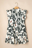 Woodland Walks Dress with flutter sleeves in forest green floral print on a beige background.