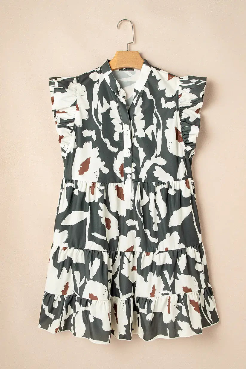 Woodland Walks Dress with flutter sleeves in forest green floral print on a beige background.