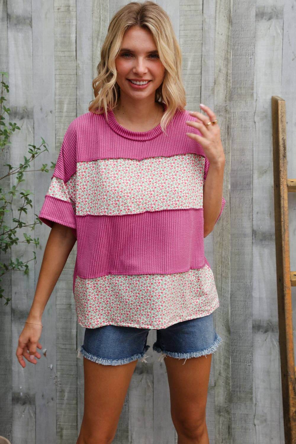Weekend Ready fuchsia floral wavy rib pullover with color block design, worn with denim shorts for chic styling.