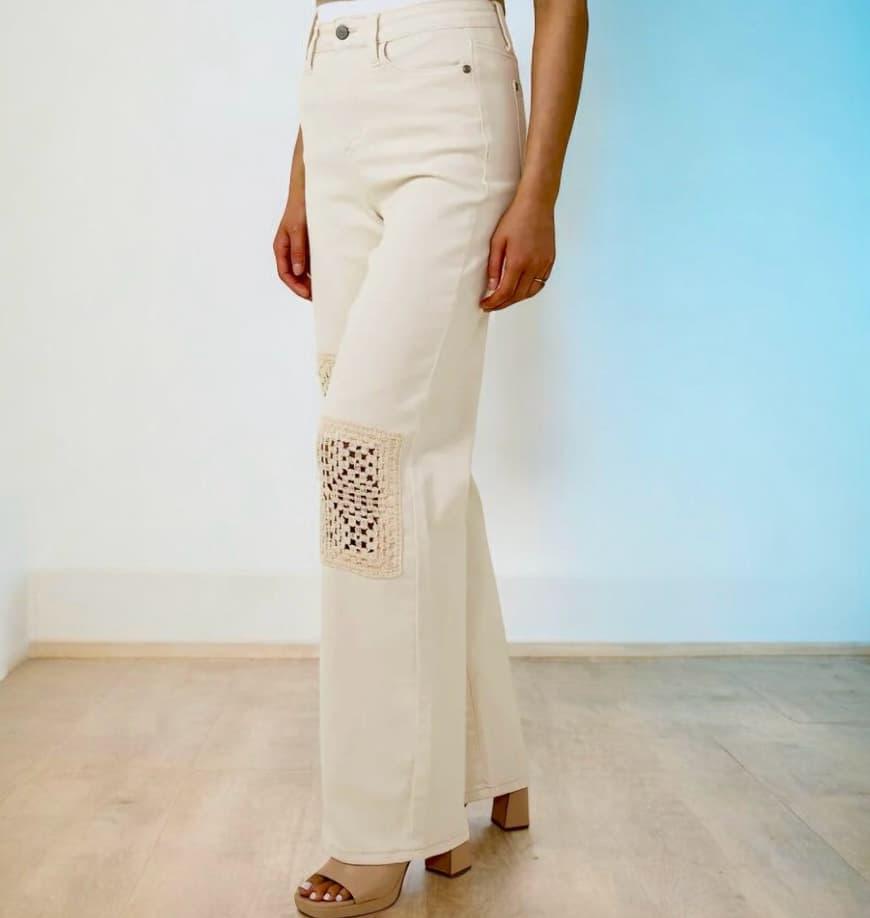 Judy Blue Valerie Jeans featuring unique crochet patches in a high-rise, wide-leg design, styled for a chic look.