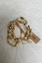 Elegant Dorianne Beaded Bracelet Set with gold, silver, and pearl tones on a soft white background.