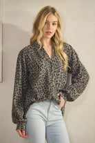 ET7975-14 LONG SLEEVE V NECK ANIMAL URBAN RIB TOP model wearing stylish animal print top with relaxed fit and v-neckline.