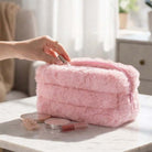 COTTON CANDY CRUSH MAKEUP CASE in soft pink faux fur, perfect for organizing makeup essentials.