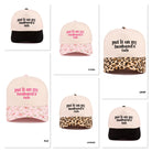 Various styles of ball caps featuring "PUT IT ON MY HUSBANDS TAB" in fun designs and colors.