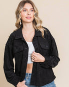 Women's black embossed shacket with dolman sleeves, button-down front, and flap pockets, perfect for casual layering.