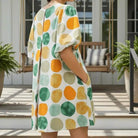 ON THE DOT DRESS - Umgee in vibrant yellow and green abstract dot print, featuring bubble sleeves and side pockets.