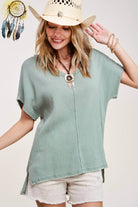 GULF BREEZES TOP - Stylish Sage Blouse | La Miel by La Miel $38.00 Stay comfy and trendy this autumn with the GULF BREEZES TOP. Perfect for lounging, this boutique blouse features raw edges, a V-neck, and a high-low hem. Teal Tiger Boutique