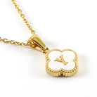 MONOGRAM MOMENTS NECKLACE featuring a gold chain and a luminous white pendant with an elegant initial design.