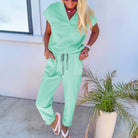 WEEKEND REWIND 2 PIECE SET (MINT) featuring a relaxed-fit V-neck tee and drawstring pants in mint green.