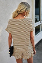 Back view of woman in striped ruffle lounge set with relaxed fit top and matching shorts for chic comfort.