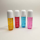 SCENT STORY by Solo En Ibiza - Four colorful body mist bottles in yellow, pink, blue, and red.