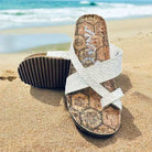 Better Be Me Sandals by Very G, ivory woven toe-loop slides on sandy beach with ocean background.