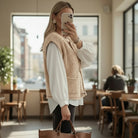 Model wearing CLASSIC COMFORT SHERPA VEST in light French beige with oversized buttons and pockets.