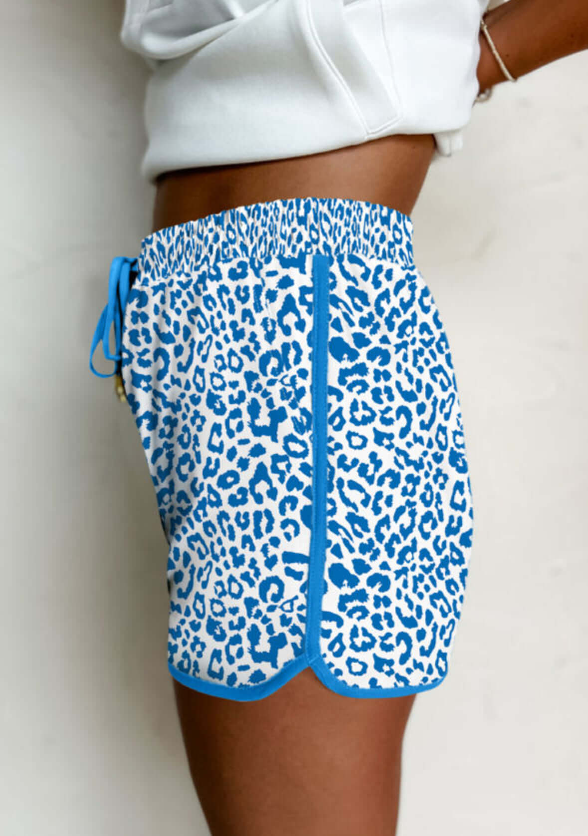 PERFECT POUNCE blue leopard print shorts showcasing a stylish side view design for summer wear.