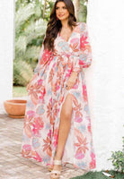 Tropical Sensation Dress with high slit, floral print, and wrap design, perfect for beach and garden parties.