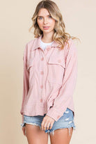 Women’s embossed soft shacket in pink with button-down front and flap pockets, perfect for casual layering.