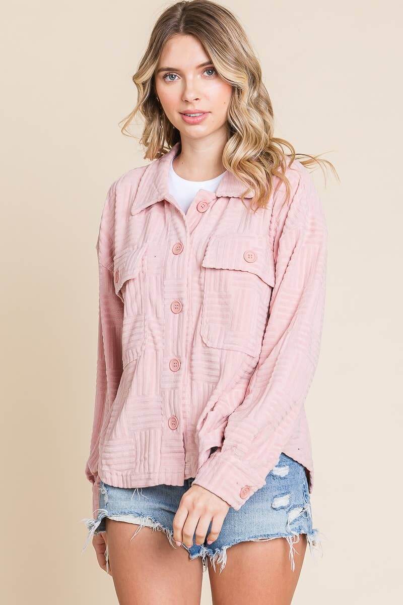 Women’s embossed soft shacket in pink with button-down front and flap pockets, perfect for casual layering.