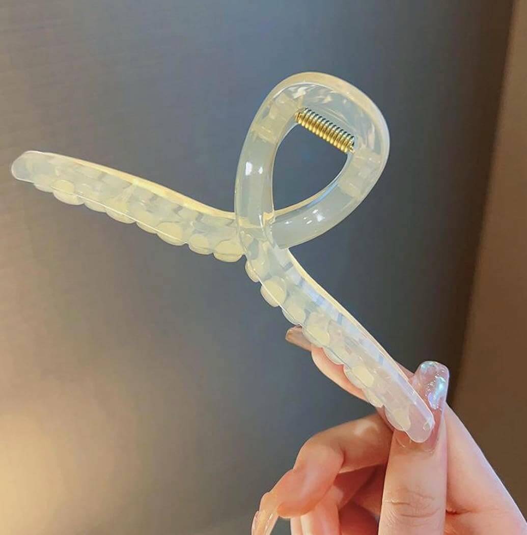 Transparent large hair clip for thick hair, featuring durable design and glossy finish, perfect for everyday styling.