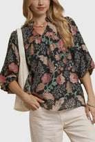Model wearing the FOREVERMORE TOP - Umgee, showcasing a floral print blouse with puff sleeves and v-neckline.