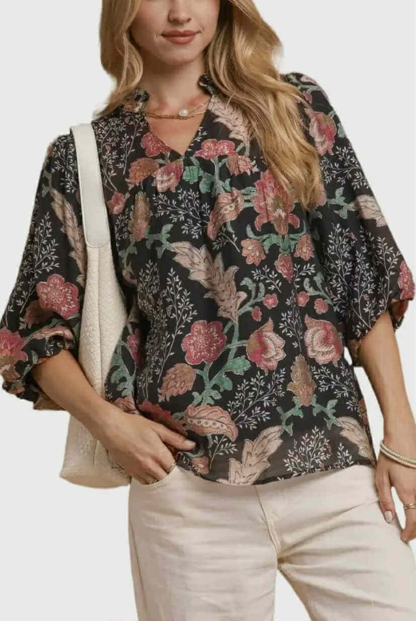 Model wearing the FOREVERMORE TOP - Umgee, showcasing a floral print blouse with puff sleeves and v-neckline.