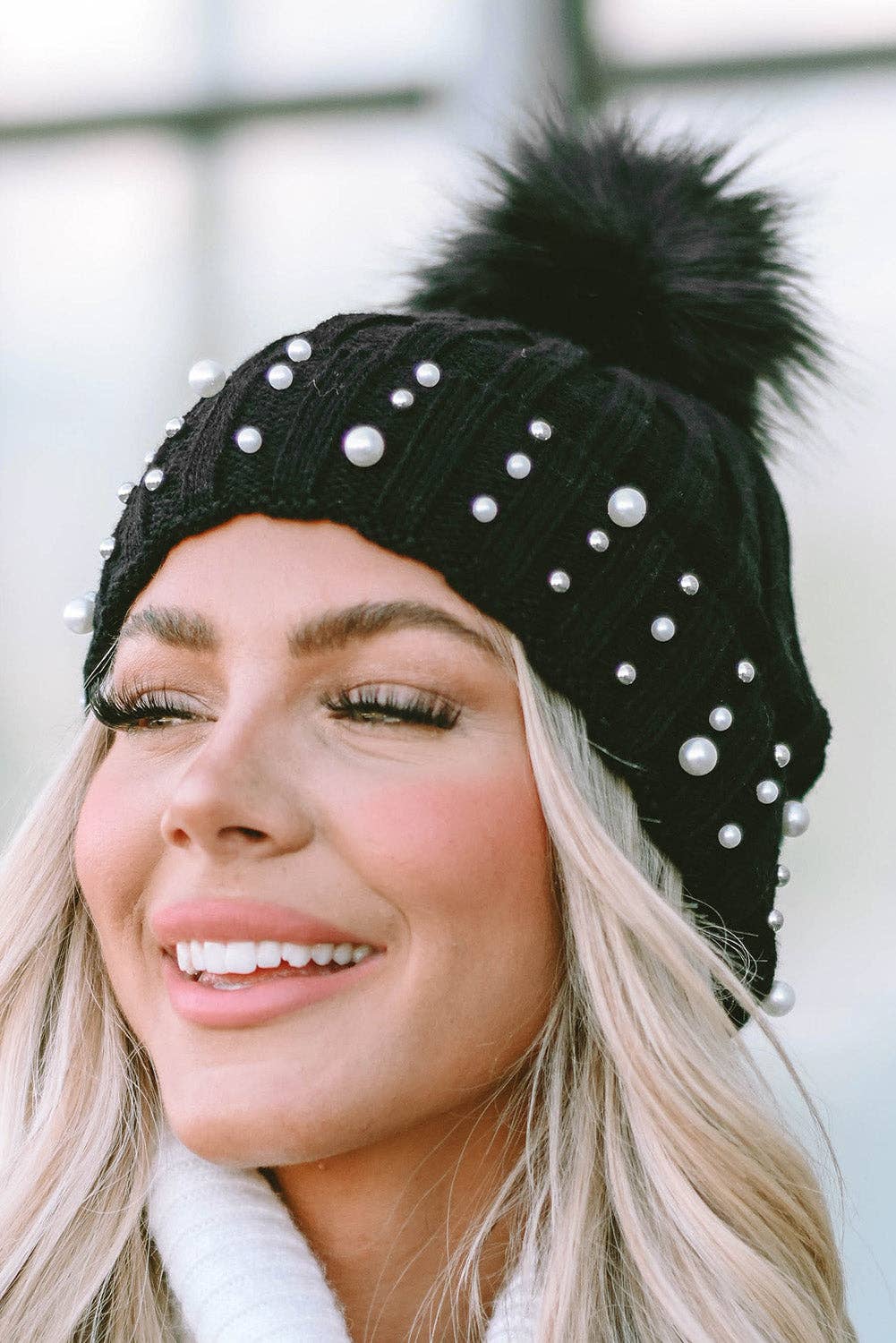 PEARL ESSENCE BEANIE by Lovesoft $10.00 Stunning pearl look beanie for a touch of elegance to any outfit. The playful pom pom adds a pop of fun and trendiness. The cuff design ensures a cozy and snug fit while the knit construction provides warmth and com