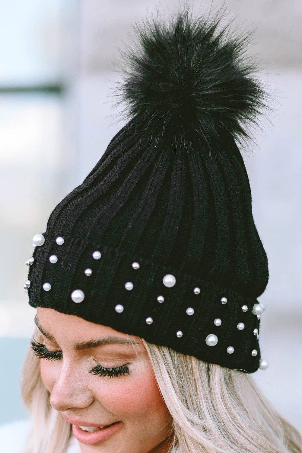 PEARL ESSENCE BEANIE by Lovesoft $10.00 Stunning pearl look beanie for a touch of elegance to any outfit. The playful pom pom adds a pop of fun and trendiness. The cuff design ensures a cozy and snug fit while the knit construction provides warmth and com