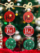 Festive HO HO HO earrings with gold-tone bow and glittery red, green, and pink Christmas balls perfect for holiday cheer.