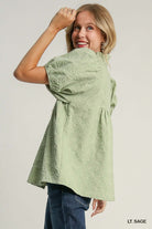 Light sage Umgee top with floral trim and leaf jacquard print, perfect for spring or fall outfits.