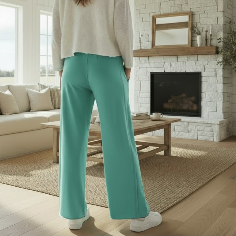 Model wearing AQUA DRIFT WIDE LEG PANTS in soft sea green, showcasing casual comfort and style.