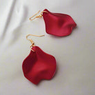 Red ruffle earrings by Vivian-Lu featuring unique design and gold tone hooks, perfect for elevating your style.