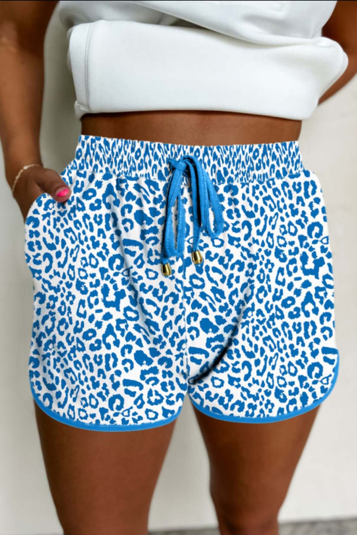 Blue leopard print shorts featuring a comfortable fit and drawstring waist, perfect for casual wear.