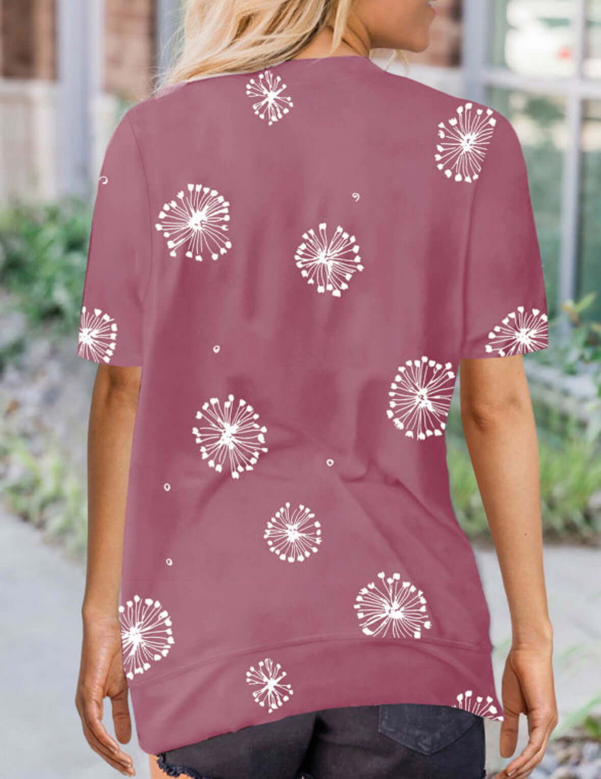 Back view of the Wishful Thinking Top in pink with whimsical dandelion prints, perfect for summer style.