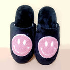 Black indoor slide slippers with pink smiley face, perfect for women's cozy comfort at home. Available in pink, aqua, and black.