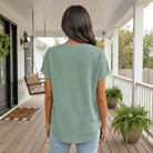Back view of the OWN THE MOMENT TOP (Sage) showcasing its textured fabric and relaxed silhouette.