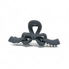 RIBBON REVIVAL HAIR CLIP (7 colors) - Matte bow claw clip in gray with a smooth finish and strong grip for effortless styling.