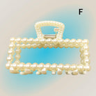 Pearl Perfection Hair Clip with imitation pearl embellishments for elegant hairstyles.