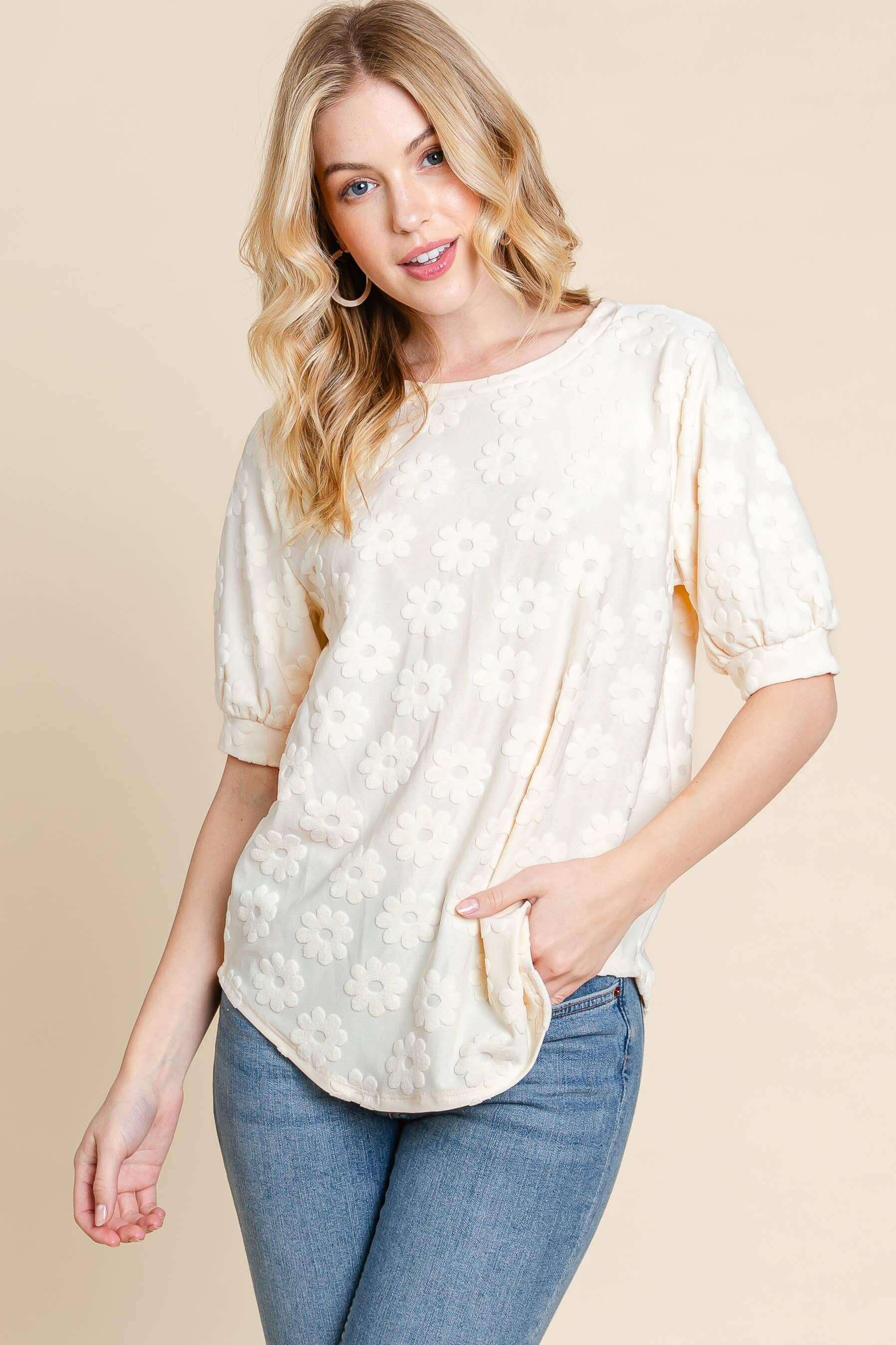 Field of Daisies Top in cream, featuring puff sleeves and textured flower embroidery for a feminine spring style.